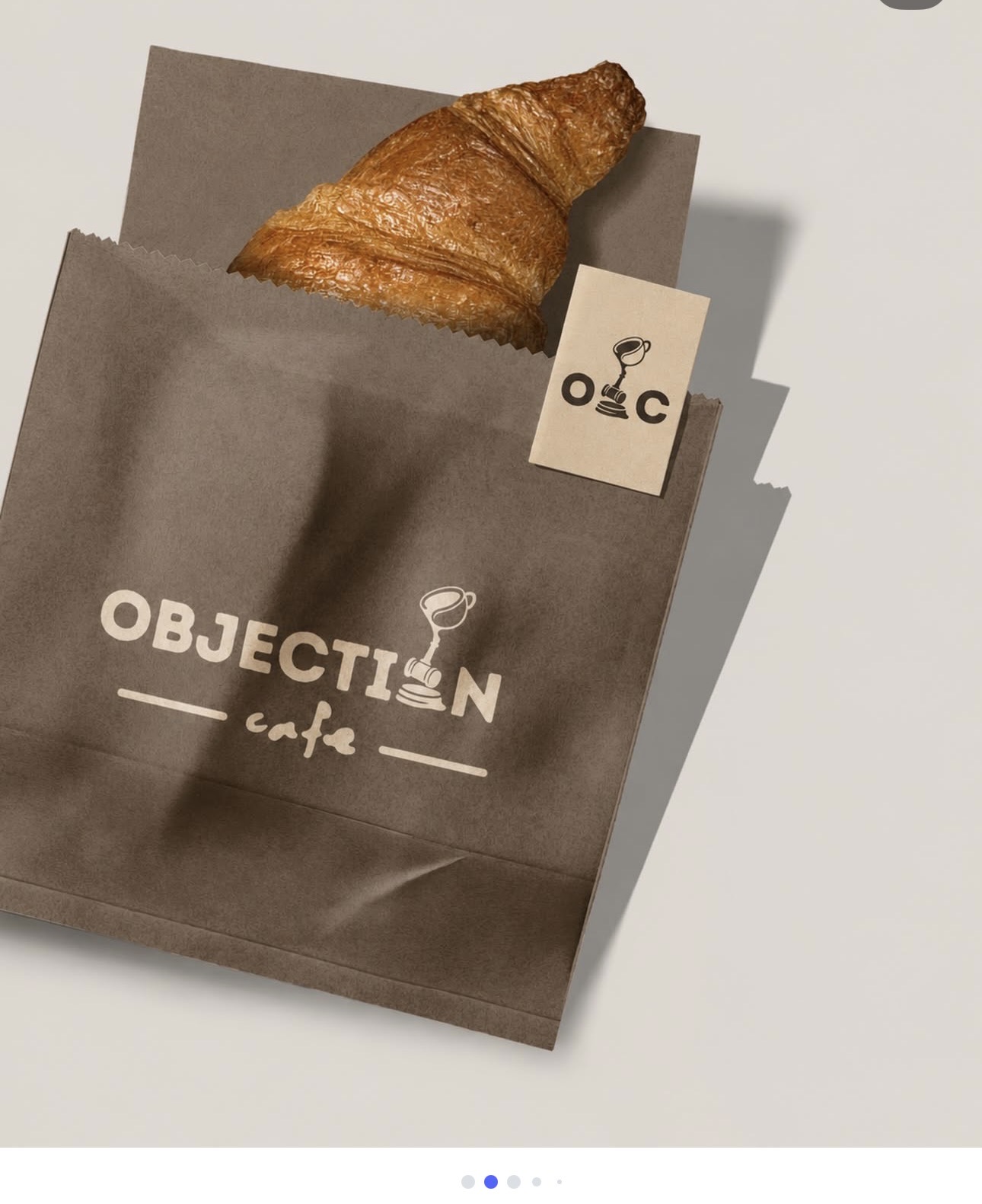 Croissant in an Objection Cafe branded bag