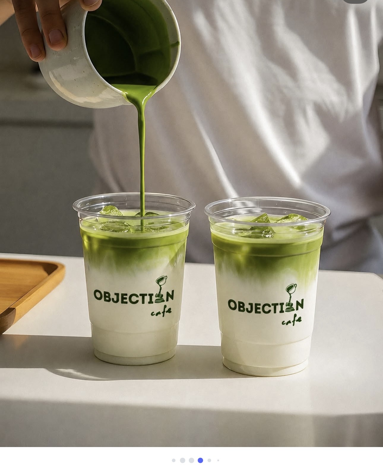 Matcha being poured into two iced cups